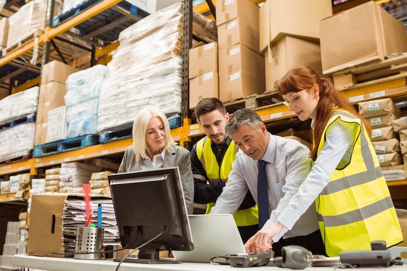 warehouse managers and worker talking